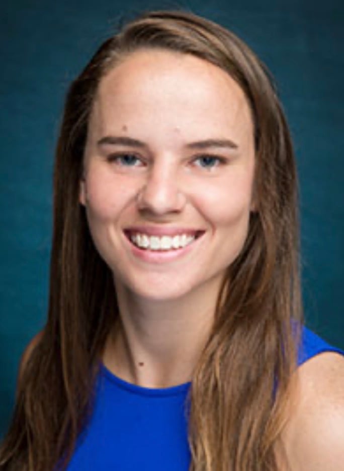 Smiling businesswoman and former professional soccer player and Division I coach